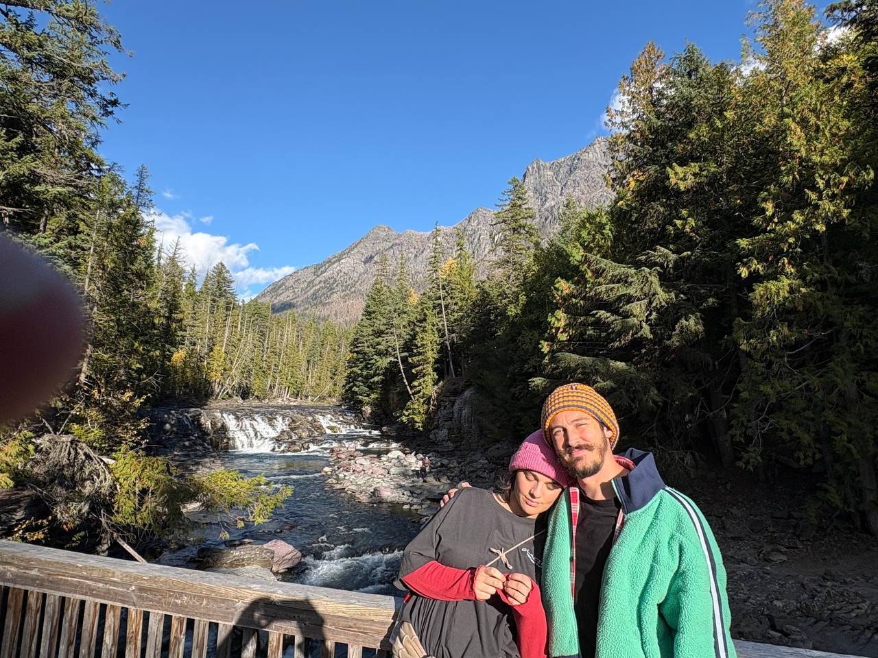 Thomas and Therese on a bridge over a mountain creek